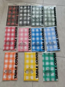 Detailed macro view of multiple multicolored checkered disposable plastic table covers