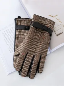 Close-up of men's brown plaid wool gloves with elegant leather strap detail for winter business