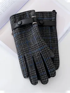 Close-up detail of men's grey plaid woolen gloves featuring elegant leather strap and buckle