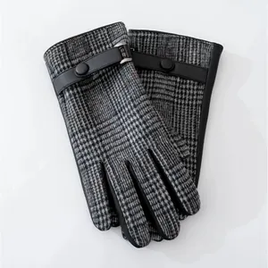 Detail view of men's plaid wool gloves with elegant leather wrist strap and button.