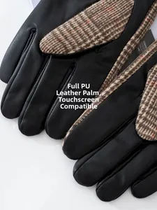 Detail view showing black PU leather palm and brown plaid wool fabric of men's gloves