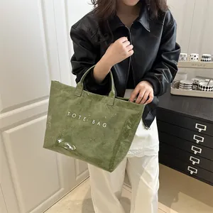 Green large capacity casual tote bag with textured finish and letter print