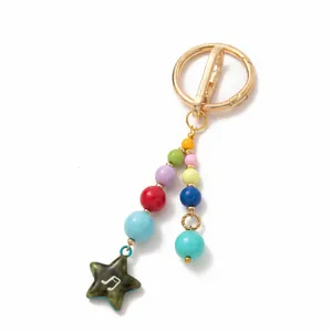 Detailed view of colorful beaded keychain featuring a star charm with a musical note