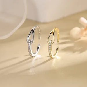 Elegant minimalist adjustable open rings with knotted design and sparkling zircon stone accents.
