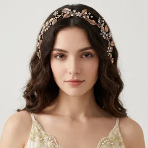 Elegant rose gold bridal headband with crystal leaf and flower details on a model