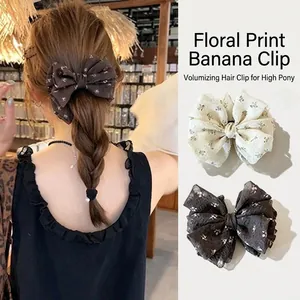 Vintage floral bow banana hair clip designed for high ponytail volume effect and style.