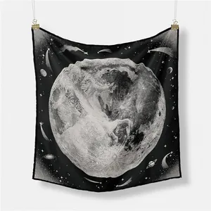 Detail of square silk scarf with black and white celestial moon and unicorn print