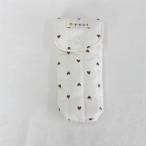 Quilted cotton storage pouch with brown heart pattern and mayrabbit tag