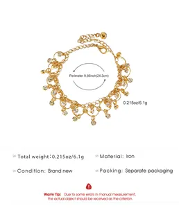 Gold-tone zircon anklet featuring bells and tassels, detailed 24.3cm perimeter specs