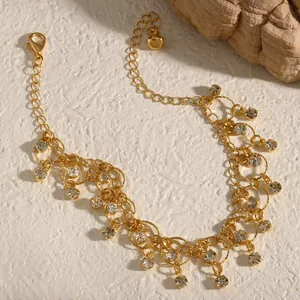 Detailed view of elegant gold tassel necklace featuring multiple sparkling zirconia dangles