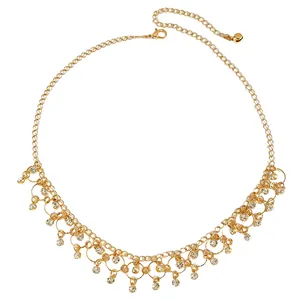 Detailed view of elegant gold necklace with zircon water drop tassels and chain.