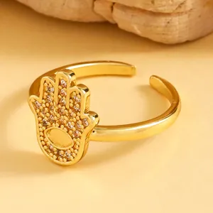 Detailed view of a vintage golden Hamsa hand open ring featuring sparkling micro-paved zircon