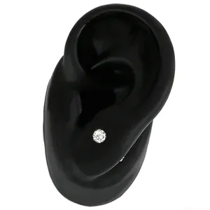 Detail shot of a sparkling crystal ball Shamballa stud earring on a display ear model