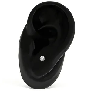 Detailed close-up of a sparkling crystal ball stud earring on a black ear display