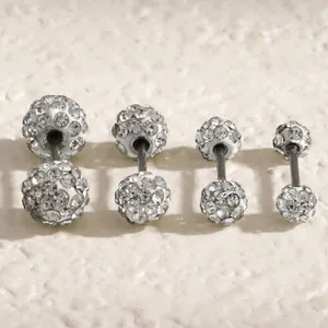 Detail view of four sizes of sparkling white Shamballa crystal ball stud earrings with screw backs