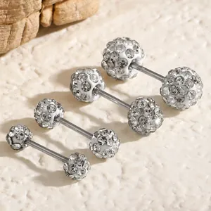Close-up of Shamballa crystal ball barbell earrings showing sparkly rhinestone detail