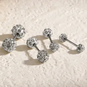 Close-up of sparkling Shamballa rhinestone ball stud earrings in four different sizes