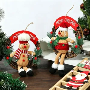 Detailed view of two Christmas gingerbread man wreaths with festive scarves and hats