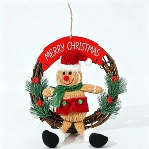 Close-up of a gingerbread man rattan wreath with 'Merry Christmas' banner for holiday decor.