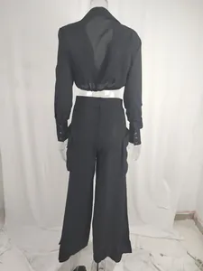 Back view of black two-piece set with long sleeve crop shirt and wide leg cargo pants