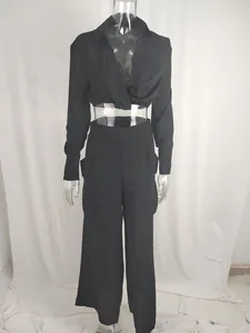 Front view detail of black cropped long sleeve shirt and high waist cargo pants set
