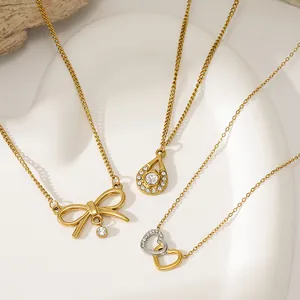 Collection of gold stainless steel necklaces featuring bow, teardrop, and heart pendants