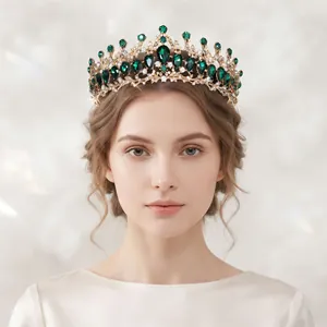 Vintage Baroque crown with emerald green rhinestones worn by a model for elegant banquets