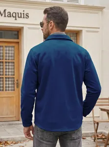 Back view of a men's navy blue casual lapel jacket with a slim fit design in an outdoor setting