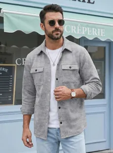 Stylish grey men's lapel shirt jacket with pockets worn by model in casual street setting