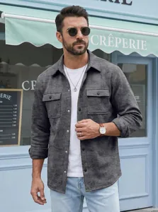 Close-up of a stylish men's charcoal grey slim fit snap button jacket worn on a model outdoors