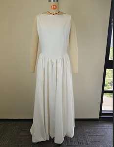 Elegant full-length white sleeveless maxi dress with gathered waist and round neckline