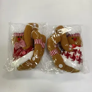 Ζευγάρι λούτρινα πιαστράκια κουρτίνας gingerbread man σε προστατευτική πλαστική συσκευασία