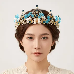 Detailed view of elegant vintage palace style tiara with blue crystals and pearls