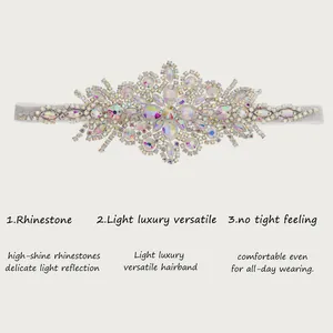 Detailed view of luxury AB rhinestone elastic headband with shiny crystal clusters.