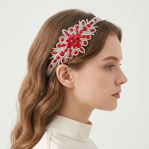Elegant red and white floral rhinestone elastic headband shown on a female model profile