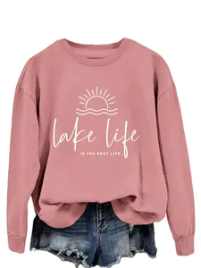 Women's pink crewneck sweatshirt with 'lake life is the best life' white graphic print