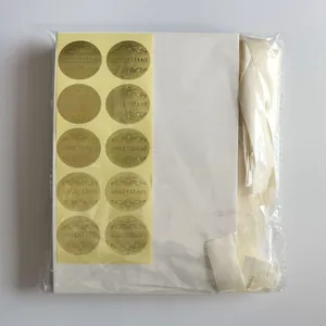 Complete wedding invitation kit with golden stickers and cream ribbons in packaging