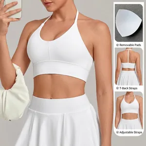 Women's white yoga sports bra featuring adjustable halter straps and removable padding