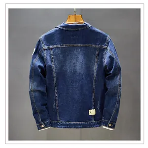Detailed back view of a slim fit blue denim jacket for men with premium washed texture