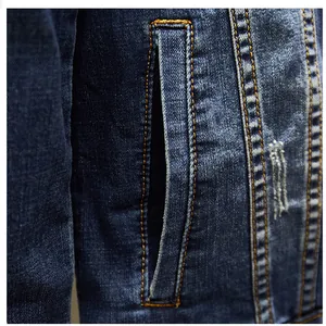 Close-up detail of men's denim jacket side pocket with contrast stitching