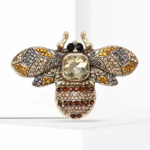 Detailed view of an alloy bee brooch featuring colorful rhinestones and champagne gems