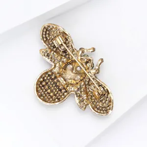 Detailed back view of vintage gold-toned alloy bee brooch showing secure pin clasp mechanism