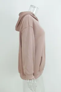 Side view detail of a dusty rose oversized long sleeve hooded sweatshirt on mannequin