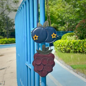 Detailed view of cute fruit-shaped children's crossbody bags with soft faux leather