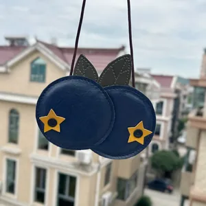 Cute children's crossbody bag featuring soft lychee pattern leather and star details.