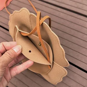 Close-up of cute scalloped edge children crossbody bag showing interior and closure