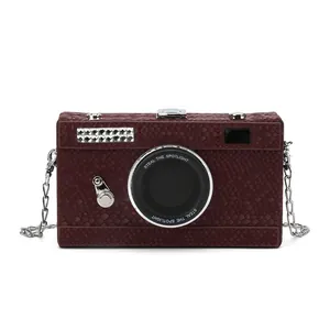 Front view of a vintage camera-shaped clutch bag with snakeskin texture and chain