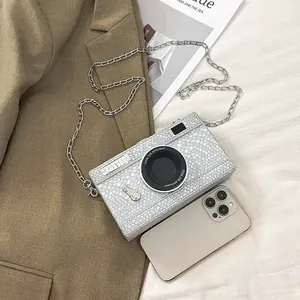 Chic silver snake-texture camera-shaped mini crossbody bag with a delicate chain strap