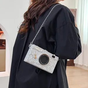 Silver vintage camera-shaped hard case crossbody bag with chain strap and textured finish