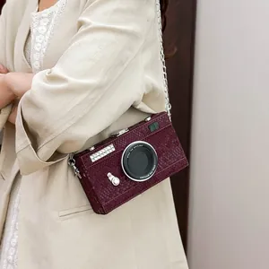Vintage camera-shaped crossbody bag in wine red snakeskin texture with chain strap